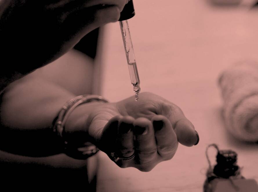 pipette dropping serum onto a hand