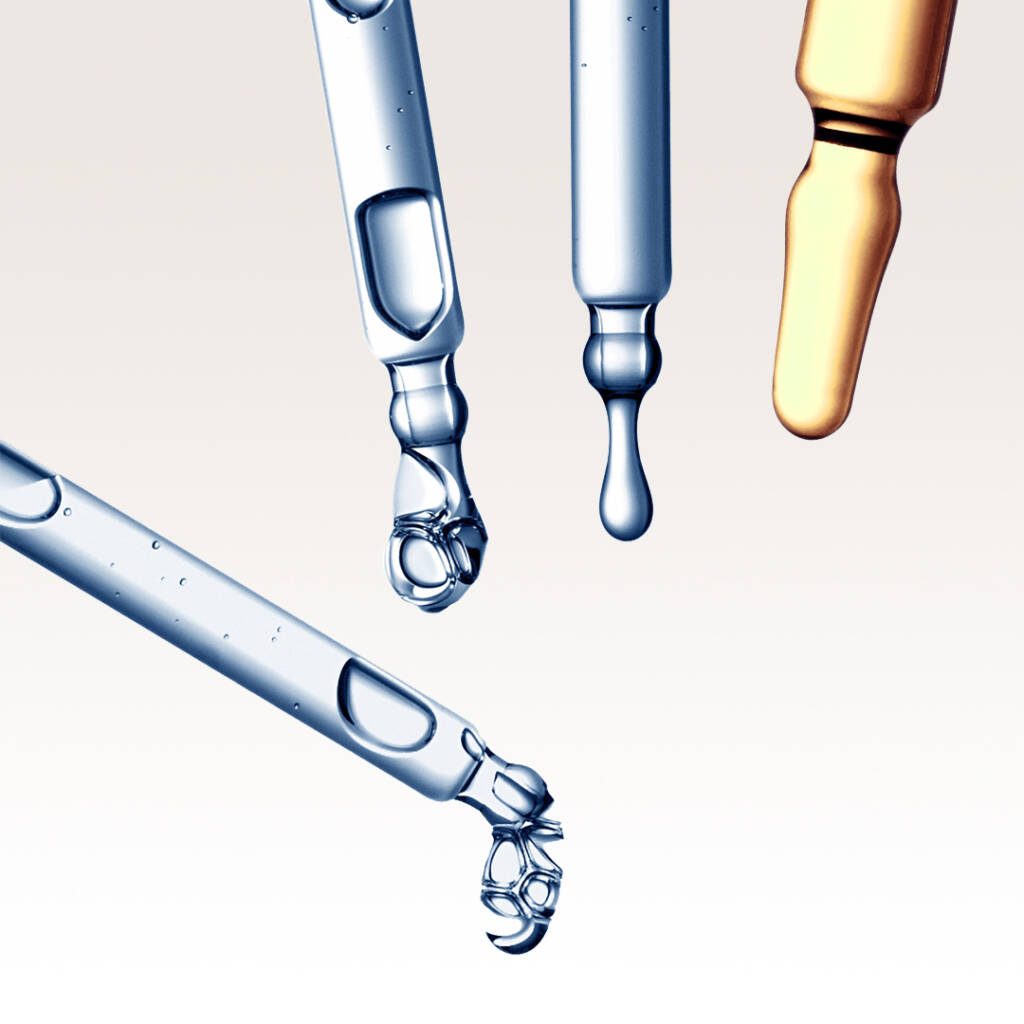 longevity serums dripping from pipettes