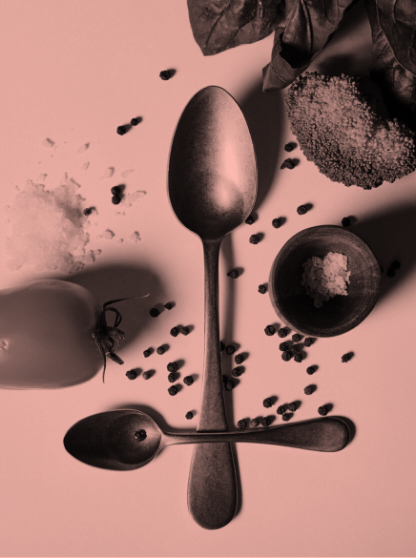 spoons on a table with supplements and powders next to them